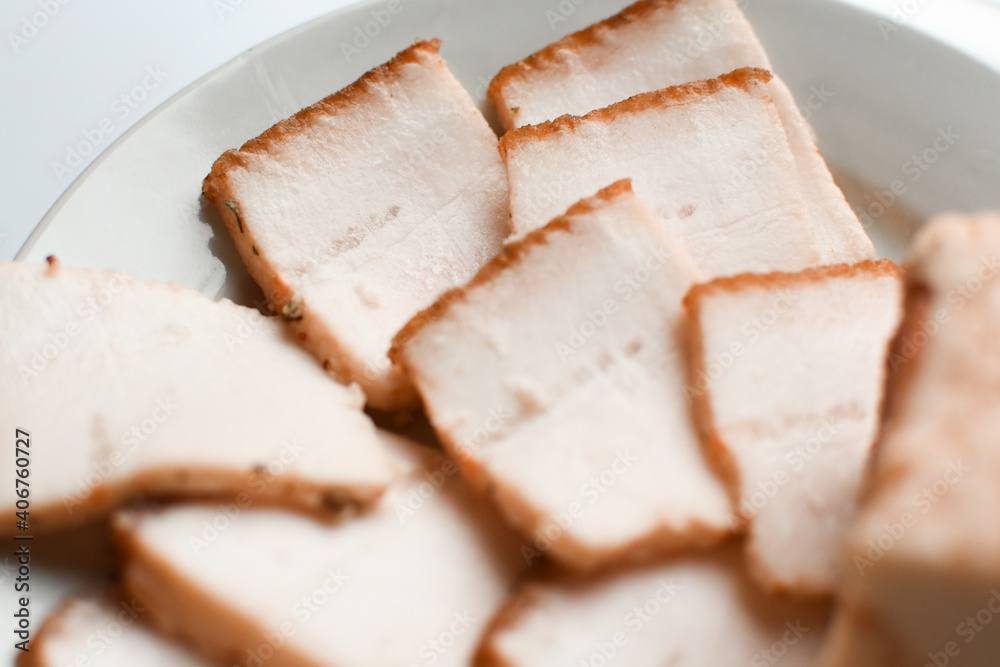 Raw chopped pork lard on a white plate, background for copy space. A large chunk of fresh fat. Ukrainian lard, traditional food. Raw chopped pork lard on a white plate, background for copy space. A large chunk of fresh fat. Ukrainian lard, traditional food.