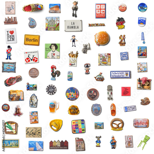 Set of 70 souvenir refrigerator magnets isolated on white from different cities of the world. Refrigerator magnets are popular souvenir and collectible objects.