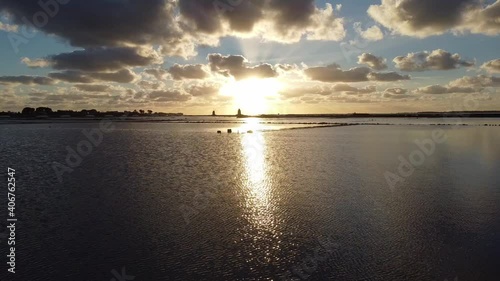 View of Marsala salt flats from drone in flight at sunset in Sicily Italy