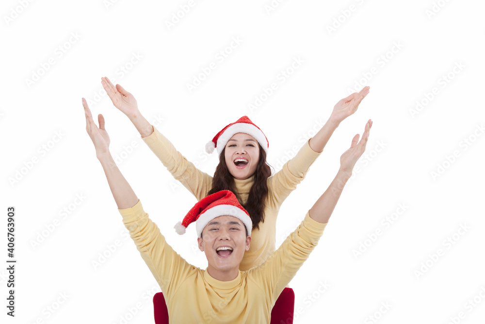 Portrait of young woman wearing santa hats,smiling Portrait of young woman wearing santa hats,smiling