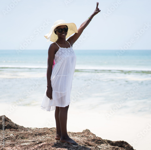 Beautiful African American girl on sea beach