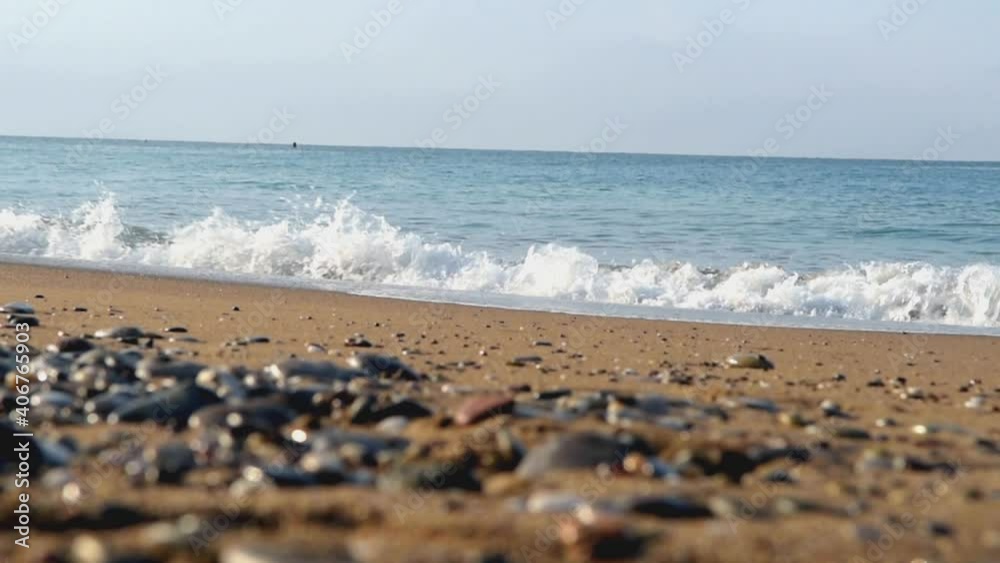 The surf of the gentle sea wave on the Turkish coast. Sandy beach The surf of the gentle sea wave on the Turkish coast. Sandy beach