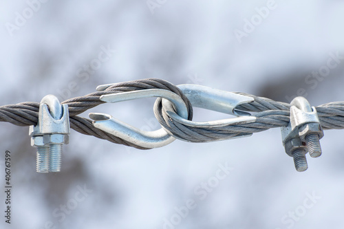 Fastening of two iron cables with thimble swivel.