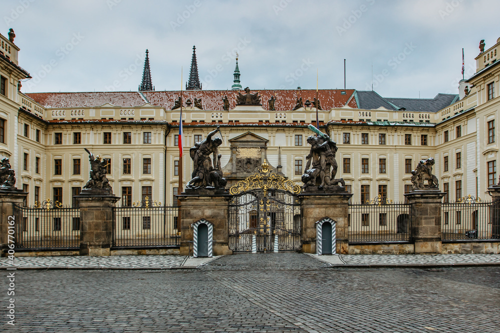 Empty and closed Prague Castle,Czech Republic, during COVID-19 pandemic lockdown in January 2021.Main gate of Prague Castle with statues. No tourists,no guards.Famous travel destination