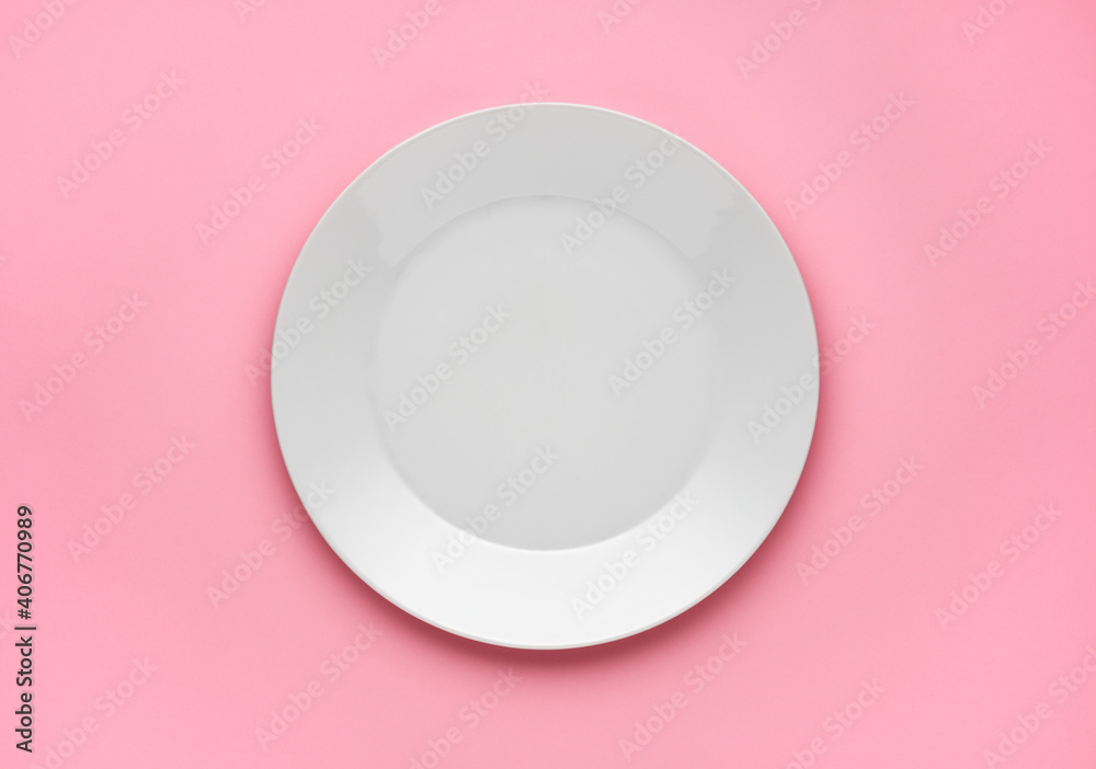 empty plate on pink background empty plate on pink background