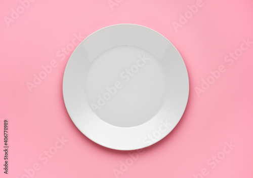 empty plate on pink background