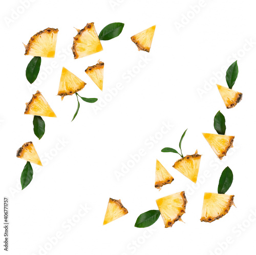 Sliced pineapple with green leaves isolated on white background. Pieces of pineapple, with clipping path. Top view.