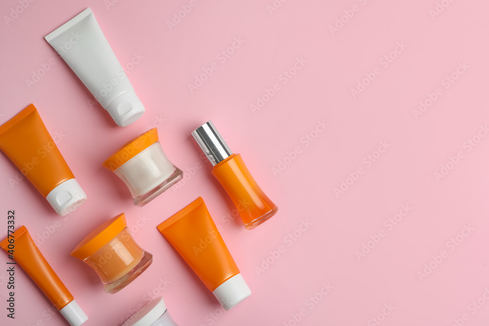 Set of luxury cosmetic products on pink background, flat lay. Space for text Set of luxury cosmetic products on pink background, flat lay. Space for text