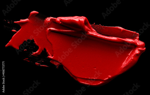 Swatch of red lipstick isolated on black background