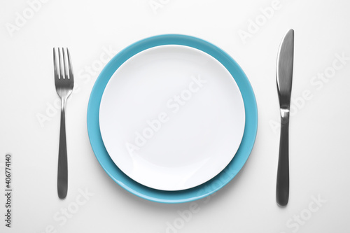 Stylish table setting on white background, top view