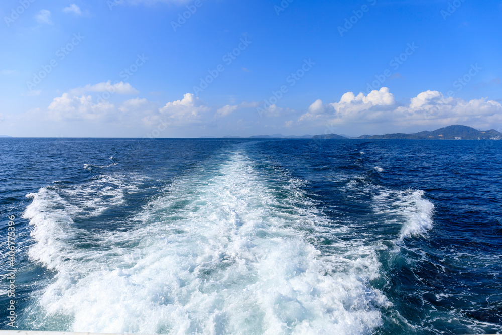 Boat wave ocean trace on blue sea fresh water background. Abstract sea water texture background. Travel destination motor boat water traces in open sea.