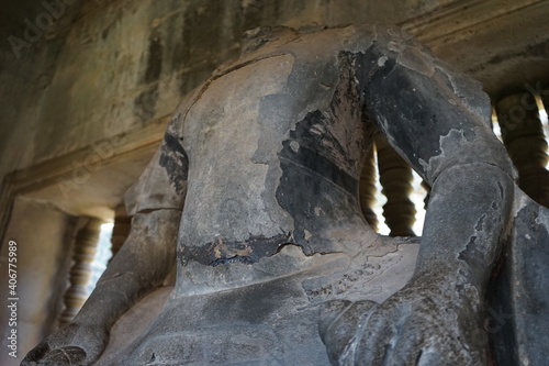 Broken statue without face at Angkor Wat temple in Siem Reap, Cambodia, Ancient Khmer architecture. 