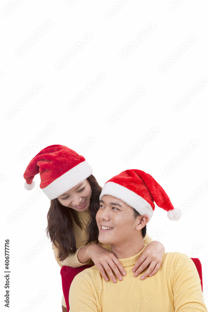 Portrait of young woman wearing santa hats,smiling Portrait of young woman wearing santa hats,smiling