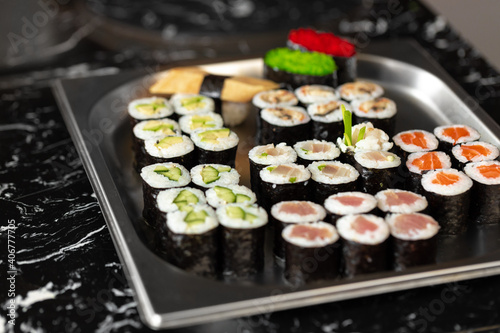 Set of maki sushi on metal tray