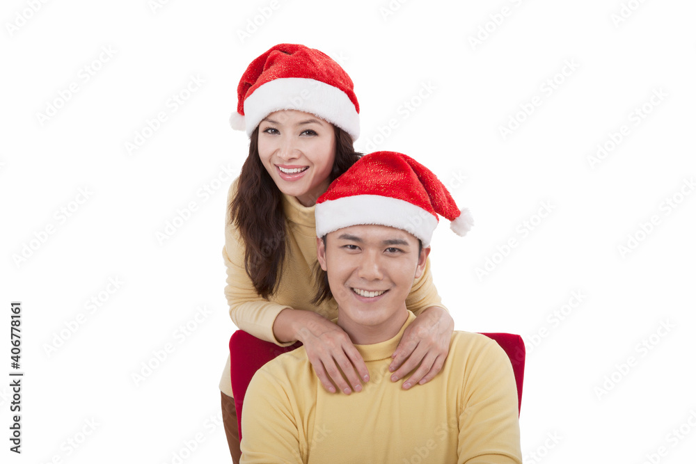 Portrait of young woman wearing santa hats,smiling Portrait of young woman wearing santa hats,smiling