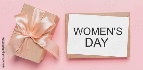 Gifts with note letter on isolated pink background, love and valentine concept with text Womens Day