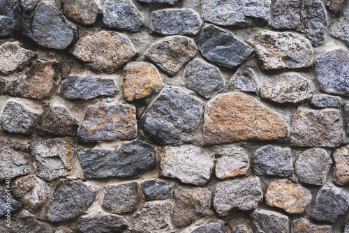 A wall of wild stone. Background from large heavy stones.