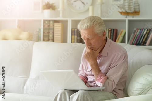  senior man using laptop at home © aletia2011