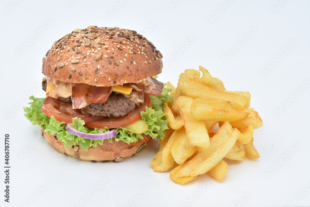 burger with melted cheese, ham, tomatoes and fried onions burger with melted cheese, ham, tomatoes and fried onions