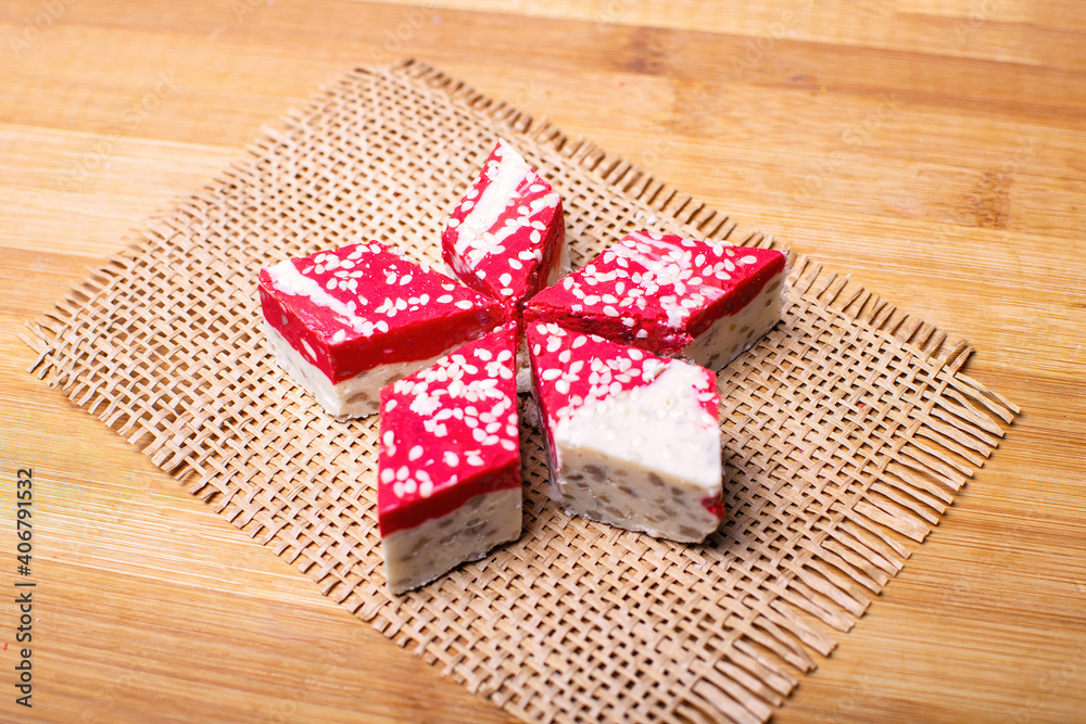 Hazelnut halva dessert with pomegranate juice on the wooden table.