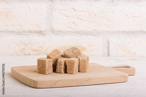 Pricked cane sugar on a wooden board