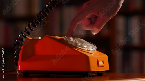 Making a phone call on an old rotary telephone