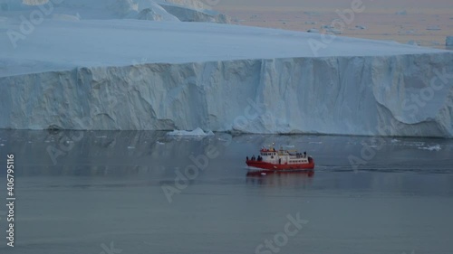 ship journey between glaciers on arctic ocean, greenland photo