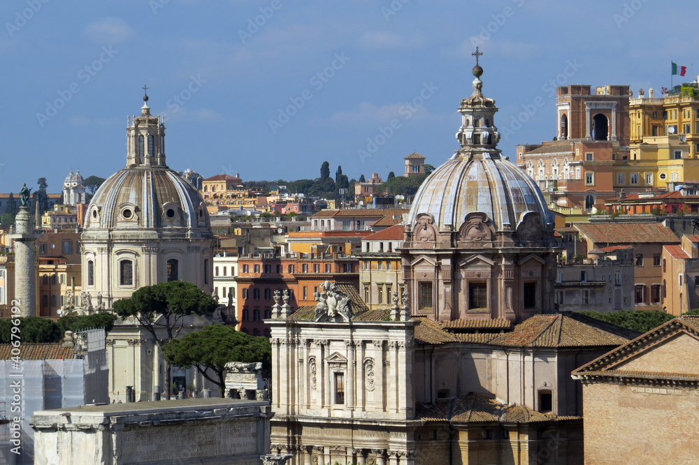 View of the roofs of the Churches of Nome di Maria or The Church of the Most Holy Name of Mary and San Maria di Loreto and Trajan's Column at the Trajan Forum in front of the capitol in Rome, Italy
