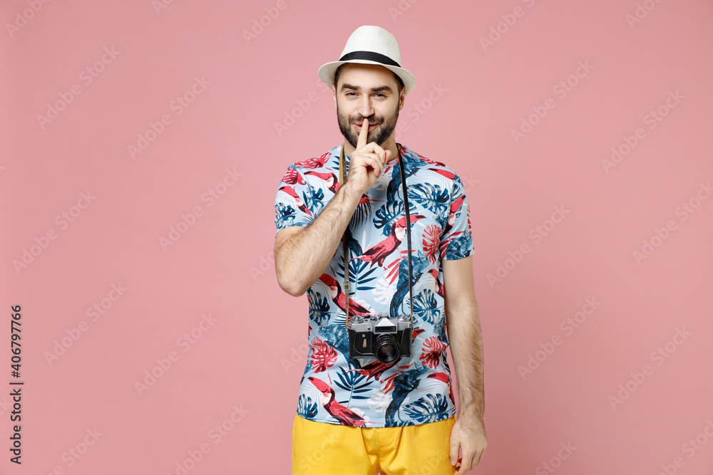 Secret traveler tourist man in summer clothes hat photo camera say hush quiet with finger on lips shhh gesture isolated on pink background. Passenger traveling on weekends. Air flight journey concept. Secret traveler tourist man in summer clothes hat photo camera say hush quiet with finger on lips shhh gesture isolated on pink background. Passenger traveling on weekends. Air flight journey concept.