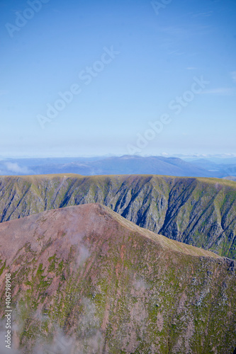 View from the top of Ben Nevis, Scotland. Highest peak in Scotland, view from the peak. Sunny Day on top of Ben Nevis. 