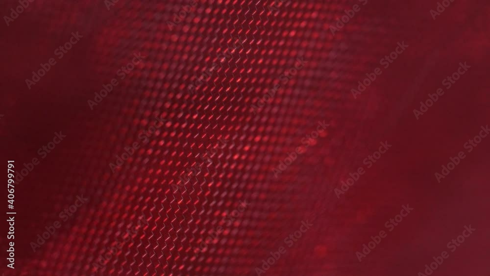 Uneasy red mesh pattern anxious light flare macro closeup