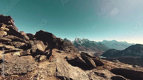 360 VR Gokyo Ri mountain top. Tibetan prayer Buddhist flag. Wild Himalayas high altitude nature and mount valley. Rocky slopes covered with ice. Panorama movement