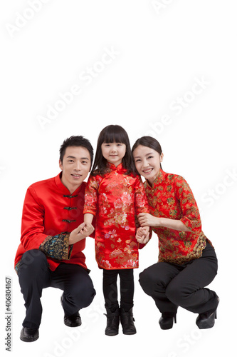 Portrait of daughter with parents in Tang suits  photo