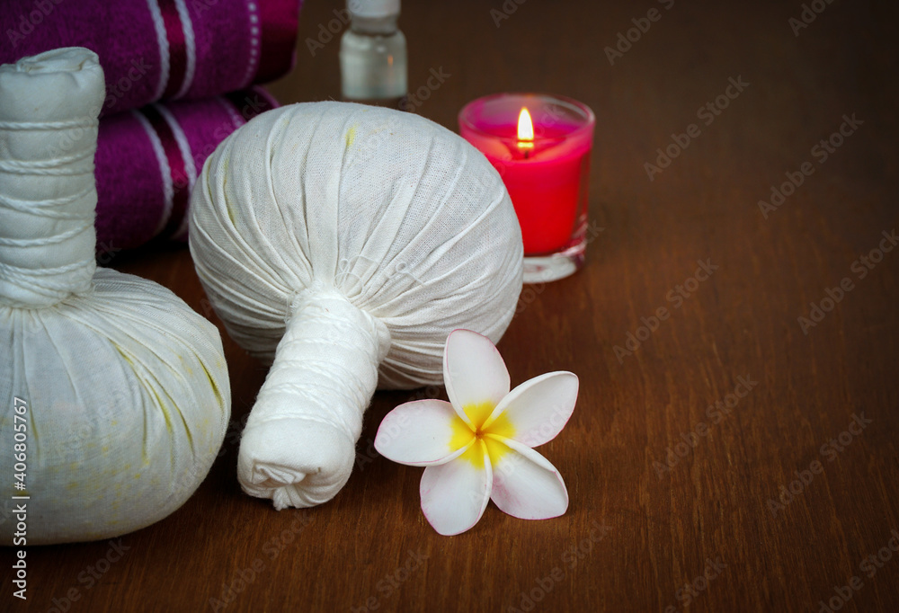 Spa composition with herbal compress ball for relaxation.beauty concept.wooden background. Spa composition with herbal compress ball for relaxation.beauty concept.wooden background.