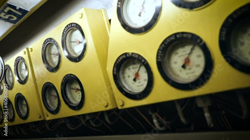 Submarine control panel. Pressure gauges located on the yellow panel above