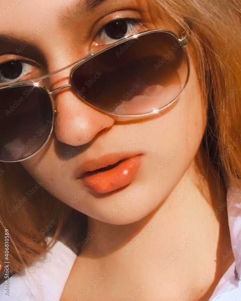 Portrait of a young beautiful girl in sunglasses. Portrait of a young beautiful girl in sunglasses.