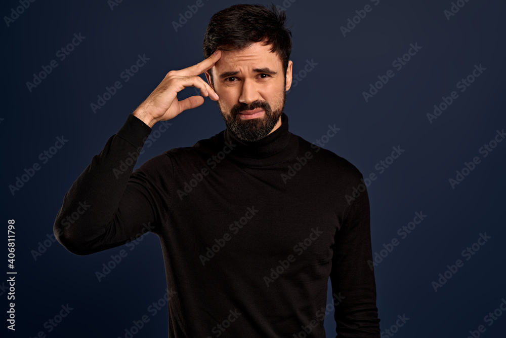 Phew, what a day. Tired distressed handsome bearded man in stylish high neck sweater, wipe sweat from forehead, frowning bothered and exhale from fatigue, working long hours to meet deadline Phew, what a day. Tired distressed handsome bearded man in stylish high neck sweater, wipe sweat from forehead, frowning bothered and exhale from fatigue, working long hours to meet deadline