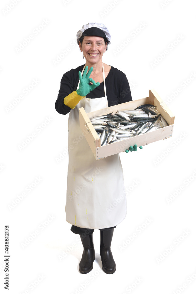 full portrait of a fishmonger holding a box of sardine and ok sign on white background full portrait of a fishmonger holding a box of sardine and ok sign on white background