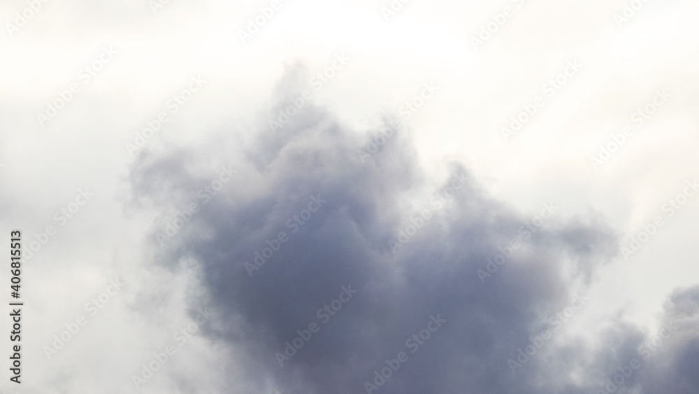 Dark cloud on a background of light sky