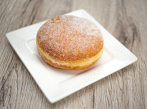 Donut on a plate. Delicious traditional German Berliner