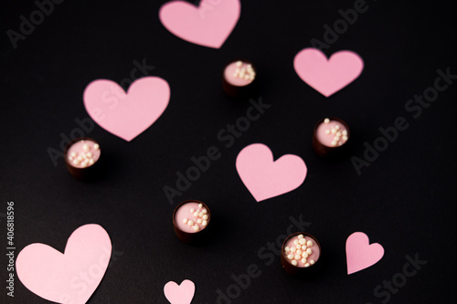hearts and candy on a black background. the theme of the Valentine's day