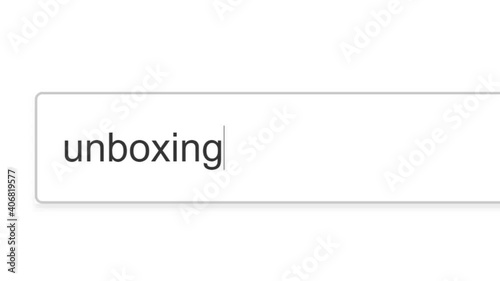 Searching For Unboxing in Search Bar Screen View. Online Network Website Search Box. Searching The World Wide Web Internet on a Computer. Typing Into Search Engine Box Viewpoint of Monitor Screen Clos photo