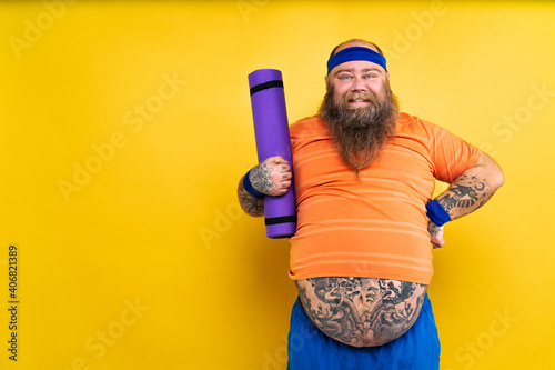 Fat man doing sport photo