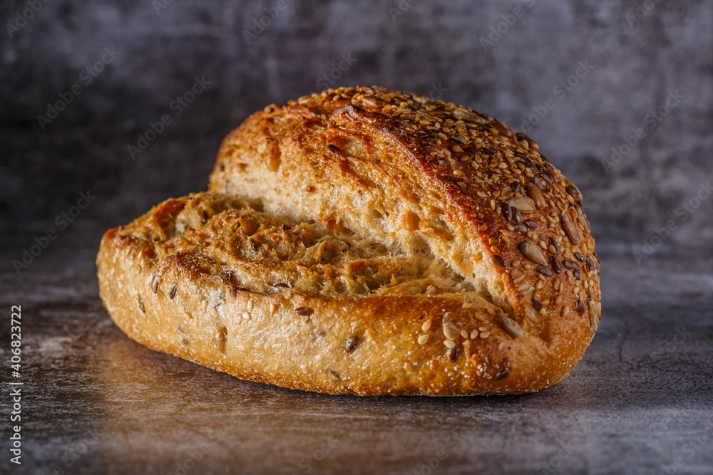 Assortment of baked bread on wooden table background Fresh fragrant bread on the table. Food concept.