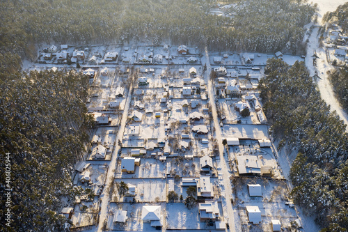 Top view of a summer village in the winter in the forest near Minsk. Belarus photo