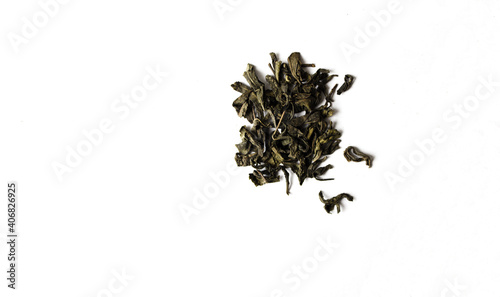 Black tea leaves on white isolated background.Black dry tea leaves.