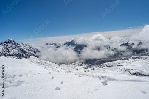 Snowy slope below Zugspitze Top of Germany in summer sunny blue sky © Davidzfr