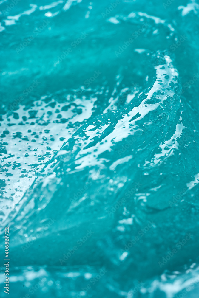 The texture of the blue cosmetic gel. Frozen liquid The texture of the blue cosmetic gel. Frozen liquid