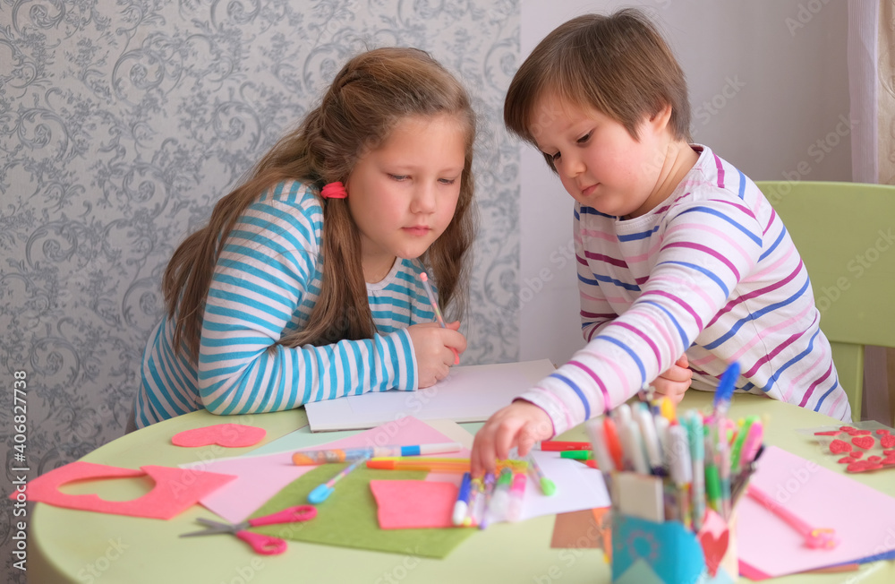 Girls kids sisters make postcards at the table. Children's creativity. Gift for valentine's day, mother's day, father's day. Children indulge, communicate. Give each other a heart
Girls kids sisters make postcards at the table. Children's creativity. Gift for valentine's day, mother's day, father's day. Children indulge, communicate. Give each other a heart