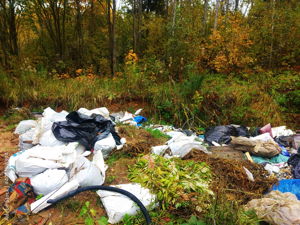 Obraz premium Unfocused background, large heaps of garbage along the road